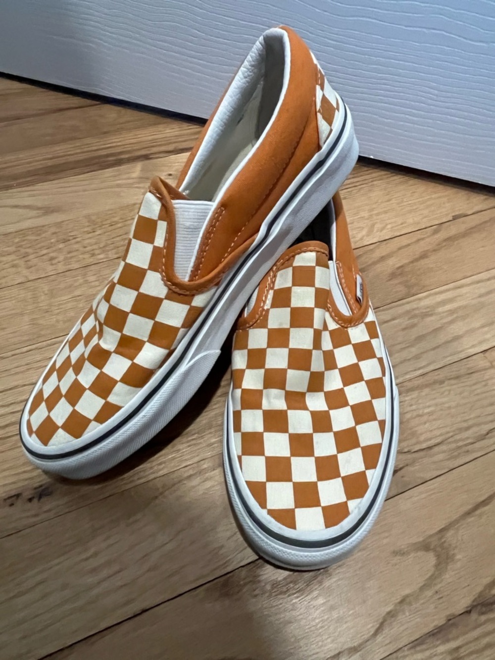 Vans Orange and White Checkerboard Slip-On Sneakers